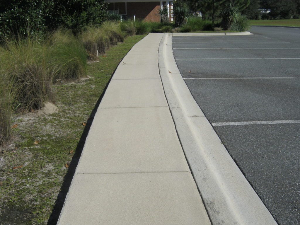 Clean sidewalk and curb.