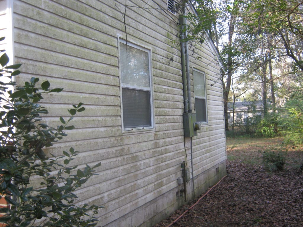 Dirty white siding on a home.