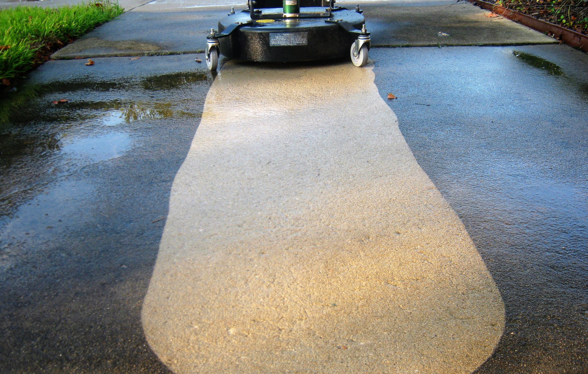 Surface cleaner pressure washing concrete.