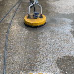 Cleaning a concrete driveway in Killearn using a Whisper Wash surface cleaner for a perfectly even finish.