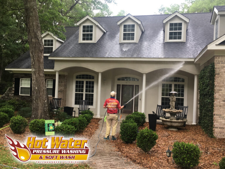 Professional company soft washing and pressure washing a house in Tallahassee, FL.
