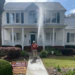 A Southwood home receiving a professional soft wash cleaning.