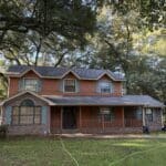 The front of a home in Killearn Lakes, FL, showcasing the restored curb appeal and property value after a professional soft wash roof cleaning.