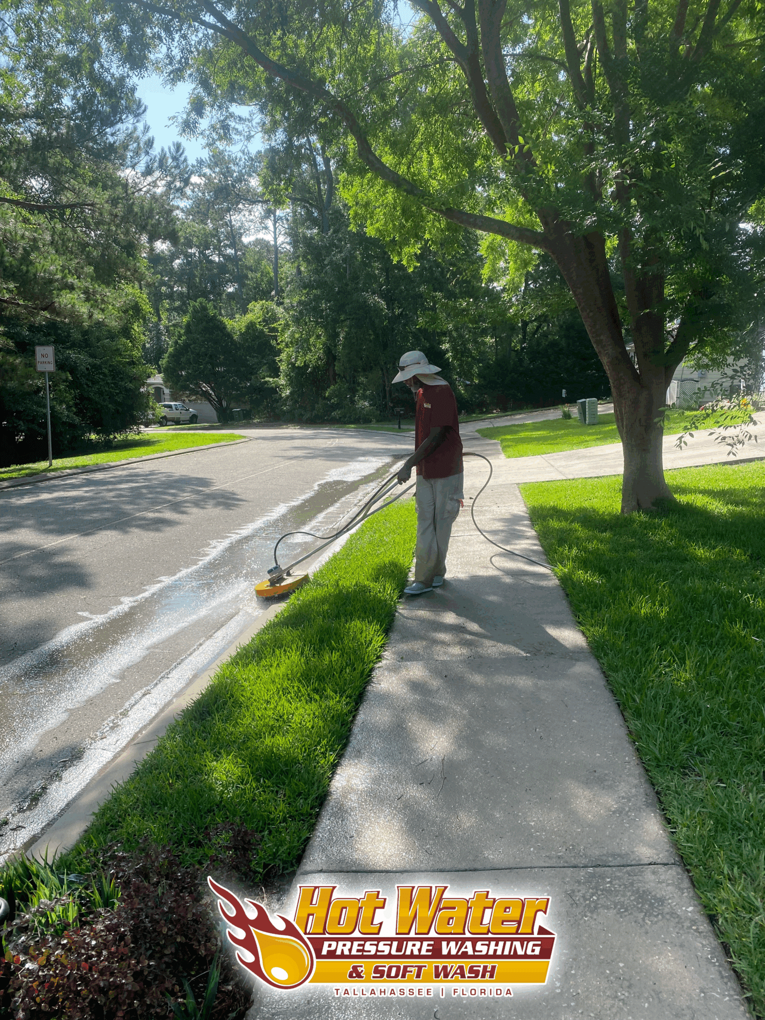 Using a professional surface cleaner to pressure wash a concrete curb and remove grime in the Killearn Commons neighborhood of Tallahassee, FL.