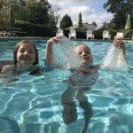Kids enjoying the Killearn Commons neighborhood pool in Tallahassee, sanitized with the same safe liquid chlorine used for professional soft washing.
