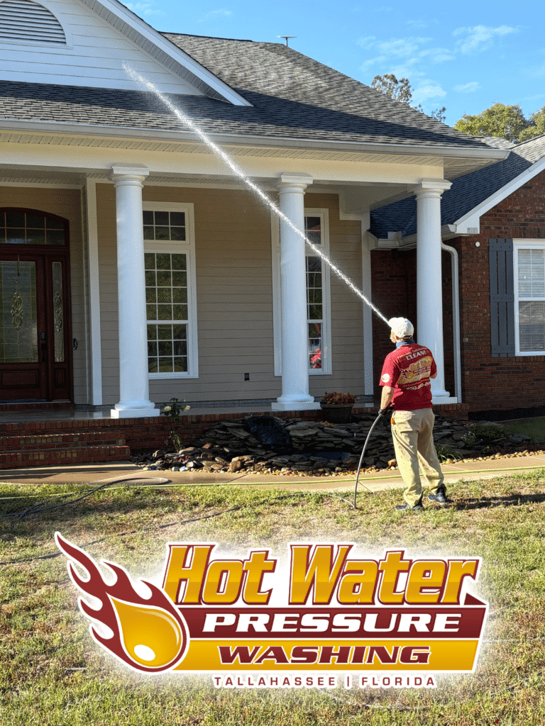 Nick Loomis performing an annual Soft Wash House Washing on a large residential exterior in Havana, serving the greater Tallahassee, Florida area.