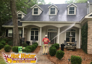 Low pressure house soft and pressure washing on a house in Tallahassee.
