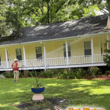 Rinsing a massive wrap-around porch during a complete property cleaning project at a beautiful home in Havana, Florida.